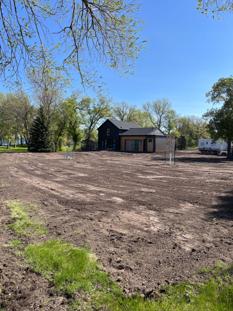 Excavation project with a house off in the distance.