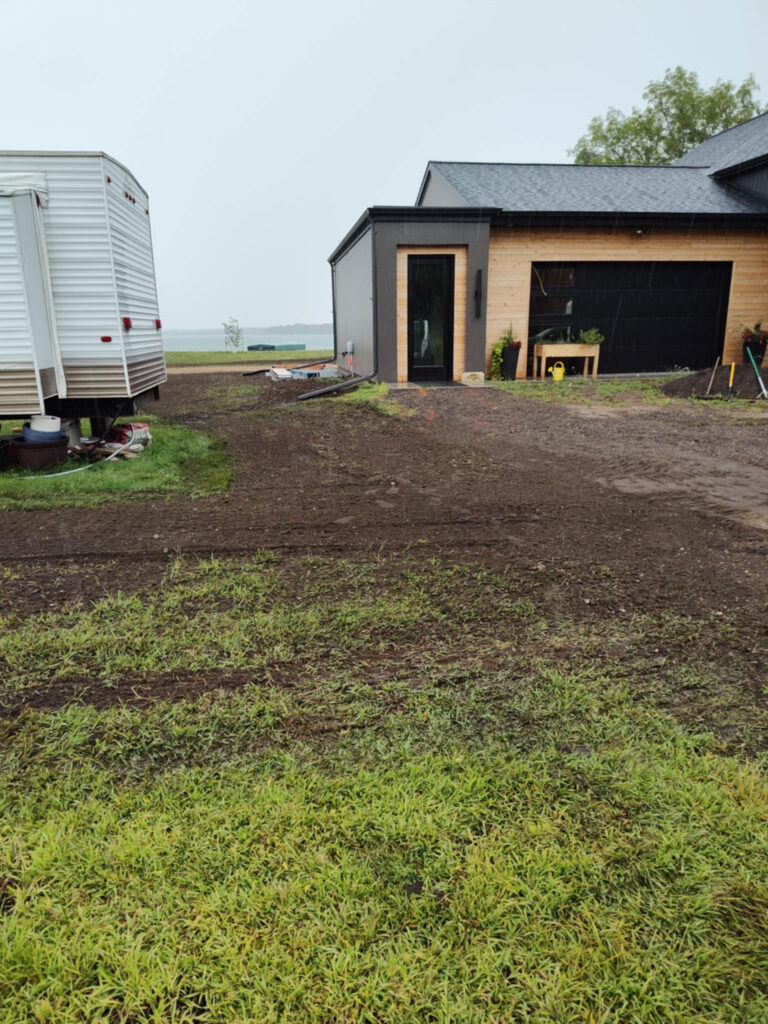 Excavation in process. Creating a driveway to a garage.
